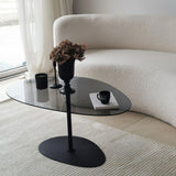 Table basse design organique en verre teinté Torpo - cadre en métal noir 