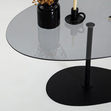 Table basse design organique en verre teinté Torpo - cadre en métal noir 