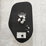 Table basse Rock ovale noire 100 x 60 cm bois composite enduit mélaminé